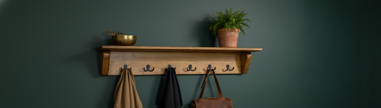 Dark brown maple coat rack on forest green wall