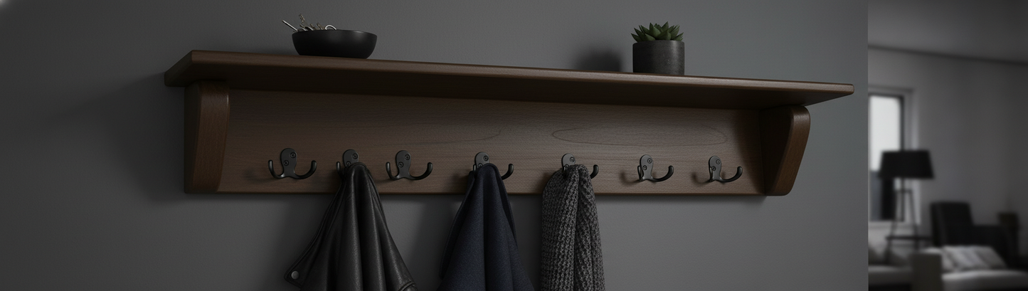 Dark stained maple coat rack on charcoal gray wall