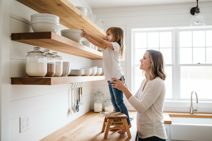 Mother and daughter baking with thick maple shelves