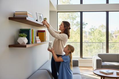 Mother and daughter decorating straight edge shelves